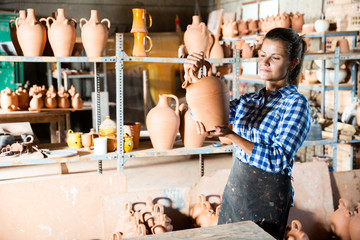 Female potter in pottery studio