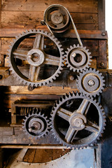 Wall Mural - Old mechanism. Old gears and pulleys with belt