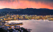 Wellington city and harbour at sunset from Mount Victoria. Wellington is the capital city of New Zealand and is located at the bottom of the North Island.