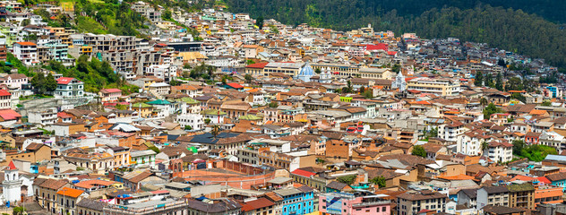 Wall Mural - Cityscape photograph of the historic city center of Quito with its colonial architecture and colors in panoramic format.