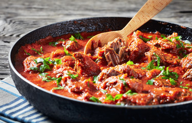 Wall Mural - close-up of spicy Beef Stew in tomato sauce