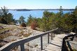© Teemu Tretjakov - Wooden stairs leading down from the rocks towards the sea. sunny spring day at Finnish archipelago in the Kemiö Island, Finland.