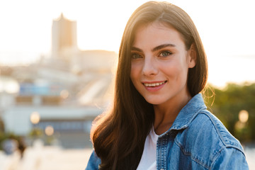 Wall Mural - Portrait of a beautiful smiling young brunette woman