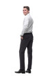 © ASDF - rear view.smiling young businessman looking at camera