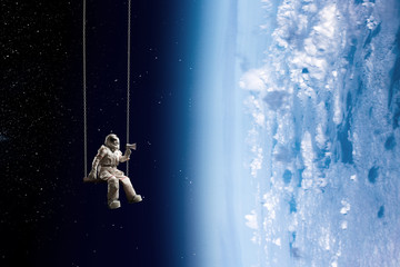 Wall Mural - spaceman and the planet earth abstract theme