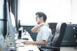 © No-Te - office worker is office syndrome, He has a headache and backache Because sitting for a long time