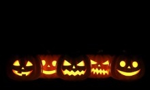 Group Of Halloween Jack O Lanterns On Dark Background. 3D Rendering Illustration