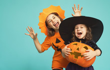 Little Witch And Pumpkin On Turquoise Background