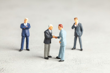  Businessmen in suits shake hands. Contract or successful deal concept.