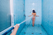 Woman having high pressure massage with Sharko shower