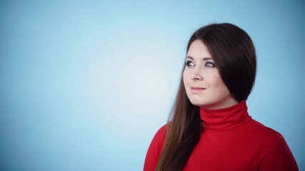 Poster - Woman wearing red polo neck looking smiley beside, on blue 4K ProRes HQ codec