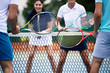 © NDABCREATIVITY - Fit happy poeple playing tennis together. Sport concept