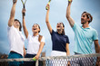 Fit happy poeple playing tennis together. Sport concept