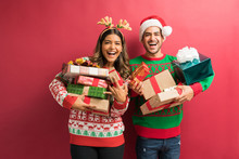 Young Woman And Man With Gift Boxes