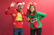 © AntonioDiaz - Funny Hispanic Couple In Ugly Sweaters During Christmas
