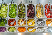 Top View Of Salad Bar With Various Types Of Vegetables And Fruits