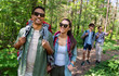 © Syda Productions - travel, tourism, hike and people concept - group of friends walking with backpacks in forest