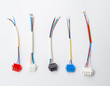 Top view few colorful wire connectors and wires on a white background