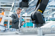 © Westend61 - Businessman with tablet in a modern factory hall