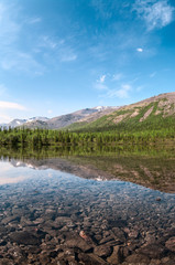 Wall Mural - The crystal waters of the mountain lake. The Khibiny Massif are the highest mountains of the Kola Peninsula, northern Russia