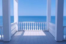 Beautiful White Terrace With Decorative Fence And Sea View Om Waterfront At Sunny Day.