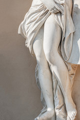 Poster - Statue of ancient sensual half naked Renaissance Era woman with long baked legs in Potsdam at smooth wall background, Germany