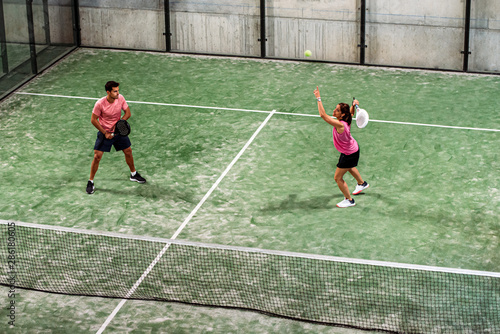 Cuadros en Lienzo mixed padel match in a padel court indoor