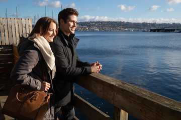 Happy couple together near water