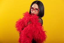 Portrait Of Pretty Asian Woman Wearing Fluffy Red Feather Boa