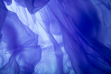 Fototapeta  - Blue plastic bag texture. Blue silk background