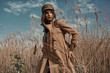Beautiful Young Stylish Girl in Trench Coat Walking Autumn or Spring street. Autumn outdoor fashion.