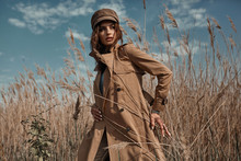 Beautiful Young Stylish Girl In Trench Coat Walking Autumn Or Spring Street. Autumn Outdoor Fashion.