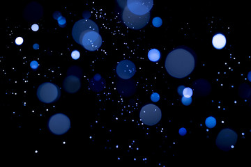 Wall Mural - blue abstract bokeh on dark background. holiday concept