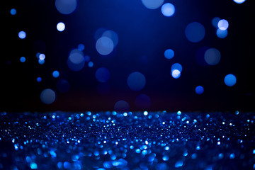 Wall Mural - blue abstract bokeh on dark background. holiday concept