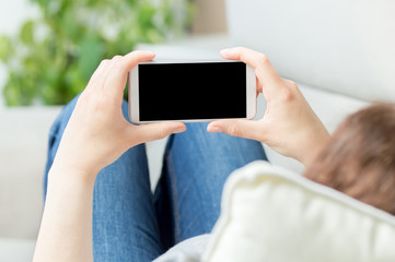 Sticker - woman hands watching media in a smart phone