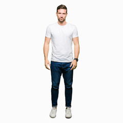 Wall Mural - Handsome man wearing casual white t-shirt depressed and worry for distress, crying angry and afraid. Sad expression.