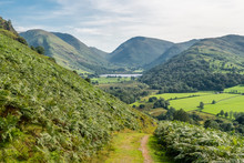 Hikking Between Brotherswater And Angle Tarn Near Patterdale In The English Lake Districr Surrounded By Many Wainwrights