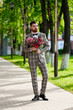 © glazunoff - Man Clothed Stylish Suit Holding Bouquet of Flower