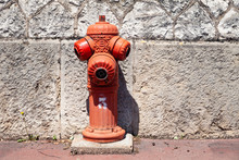 Closeup Typical Red Fire Hydrant On Street, Outdoor. Plumbing For Fire Hydrant On Public Footpaths