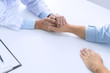 © mojo_cp - Medical doctor holding a patient hand in hospital.