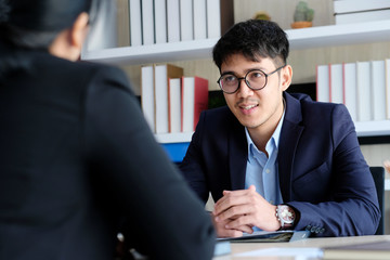 Young asian businessman smiling at business meeting, job interview, in office, business people, office lifestyle concept