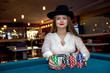 © RomanR - Beautiful woman in casino with colorful chips