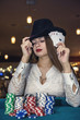 © RomanR - Woman in casino showing combination of aces