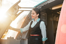 Beautiful Female Flight Attendant Is On Duty On Board