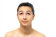 © karelnoppe - Face shot of young woman looking up.