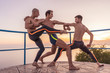 © Tommaso Lizzul - Three young beautiful male ballett dancers posing by the sea
