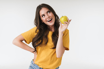 Sticker - Photo of caucasian woman 20s wearing casual clothes smiling and holding green apple