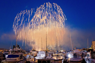 Panoramic lovely view of fireworks on the Principality of Monaco on a stormy day