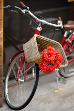 Romantic View Of Bike With Bouquet Of Red Flowers On Street Of Town.