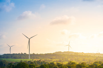 green energy concept, eco power. wind turbine located along the hill with the wind blowing all the t